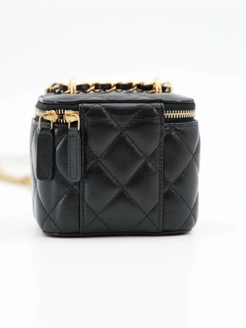 CHANEL Black Quilted Lambskin Mini Vanity Case with Gold Carving CC